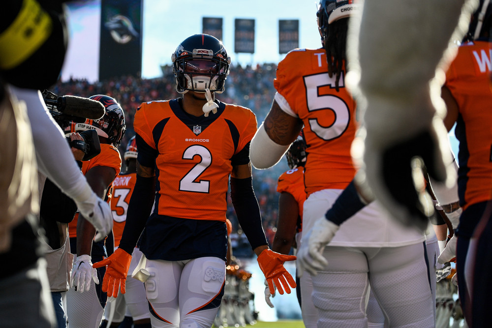 Denver Broncos cornerback Pat Surtain II (2) runs onto the field during player introductions before a game between the Los Angeles Chargers and the Denver Broncos at Empower Field at Mile High on January 8, 2023 in Denver, Colorado.