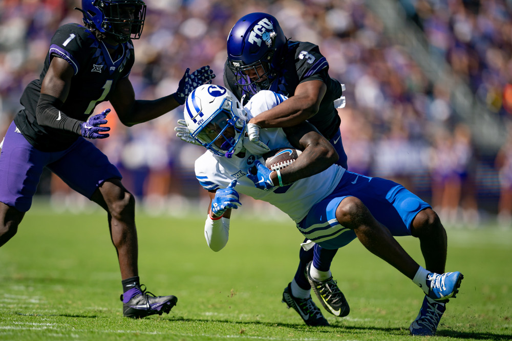 TCU Horned Frogs safety Mark Perry (3) tackles a Brigham Young Cougars player during a game between the Brigham Young Cougars and the TCU Horned Frogs on October 14, 2023, at Amon G. Carter Stadium in Fort Worth, TX.