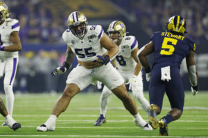 Washington Huskies offensive lineman Troy Fautanu (55) blocks during the CFP National Championship against the Michigan Wolverines on January 08, 2024 at NRG Stadium in Houston, Texas.