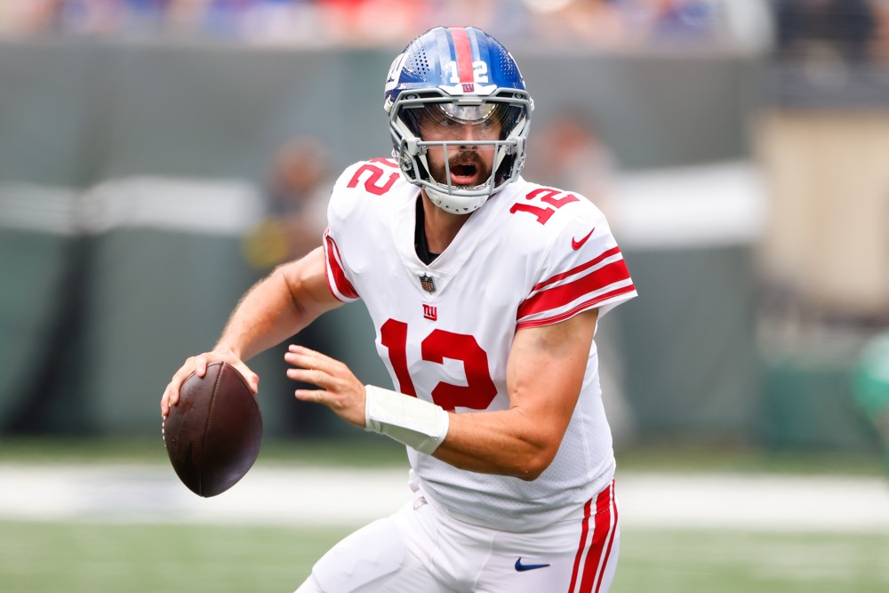 New York Giants quarterback Davis Webb (12) rolls out during the second quarter of the National Football League game between the New York Jets and the New York Giants on August 28, 2022 at MetLife Stadium in East Rutherford, New Jersey.