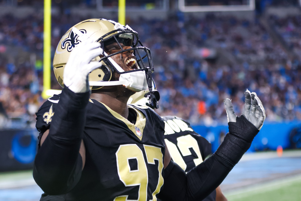 Malcolm Roach #97 of the New Orleans Saints celebrates after a turnover by the Carolina Panthers during a football game on September 18, 2023, at Bank of America Stadium in Charlotte, NC.