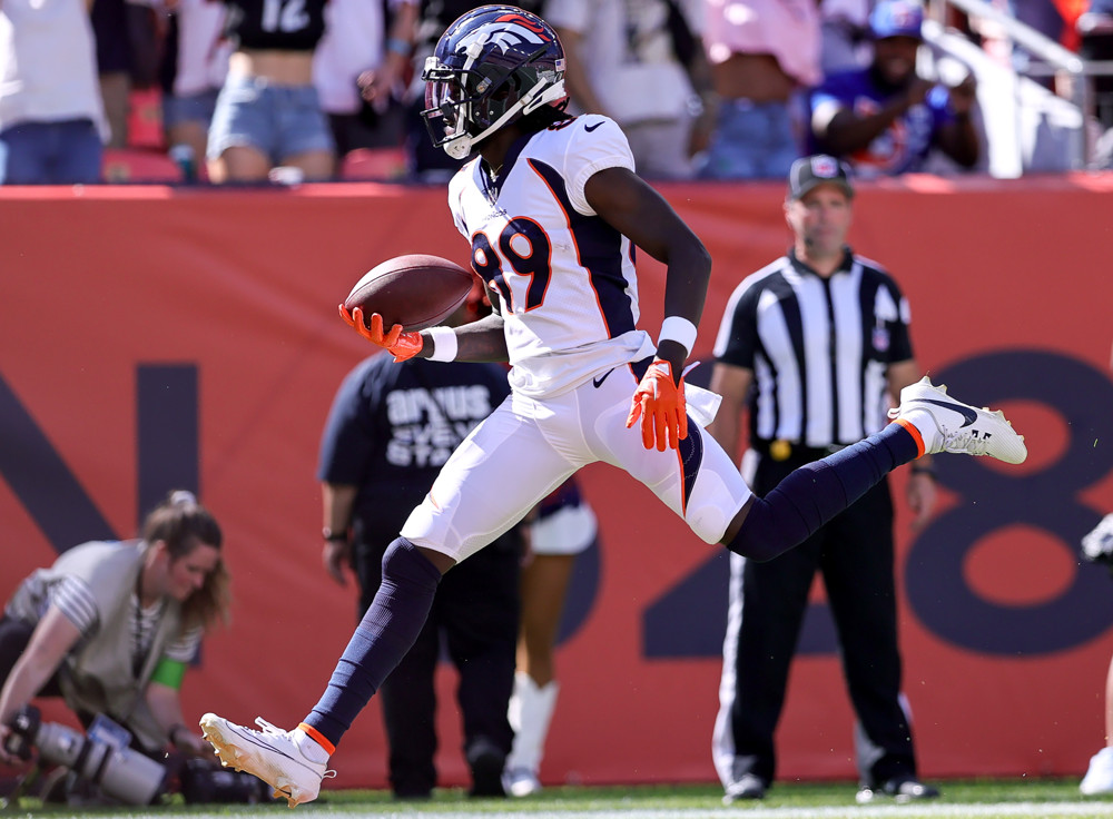 Denver Broncos wide receiver Brandon Johnson walks into the end zone for a touchdown reception during the first half of an NFL game between the Washington Commanders and the Denver Broncos on September 17, 2023 at Empower Field at Mile High in Denver, CO.