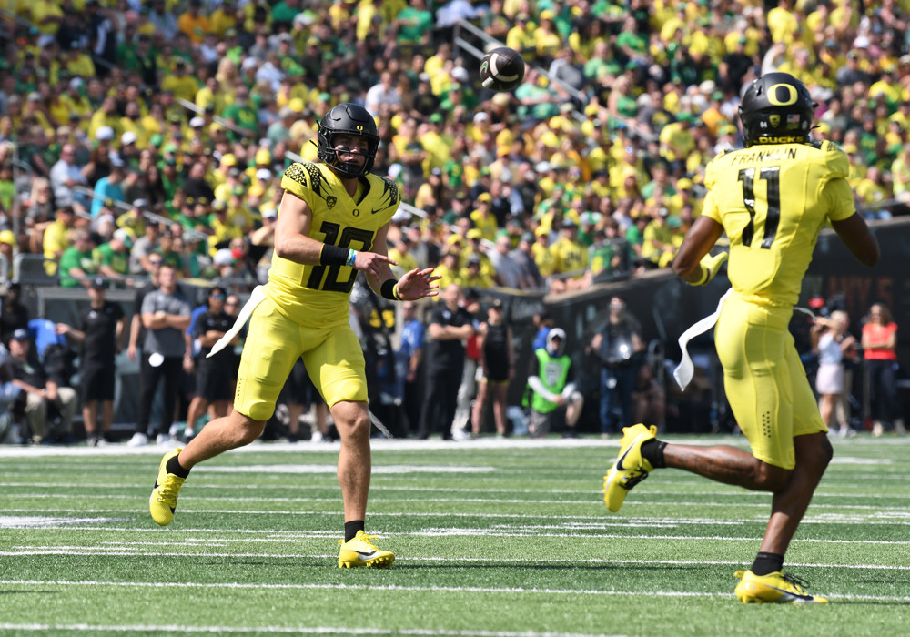 Denver Broncos quarterback Bo Nix (10) throws to Denver Broncos wide receiver Troy Franklin (11) during a college football game between the Oregon Ducks and Portland State Vikings on September 2, 2023, at Autzen Stadium in Eugene, Oregon.