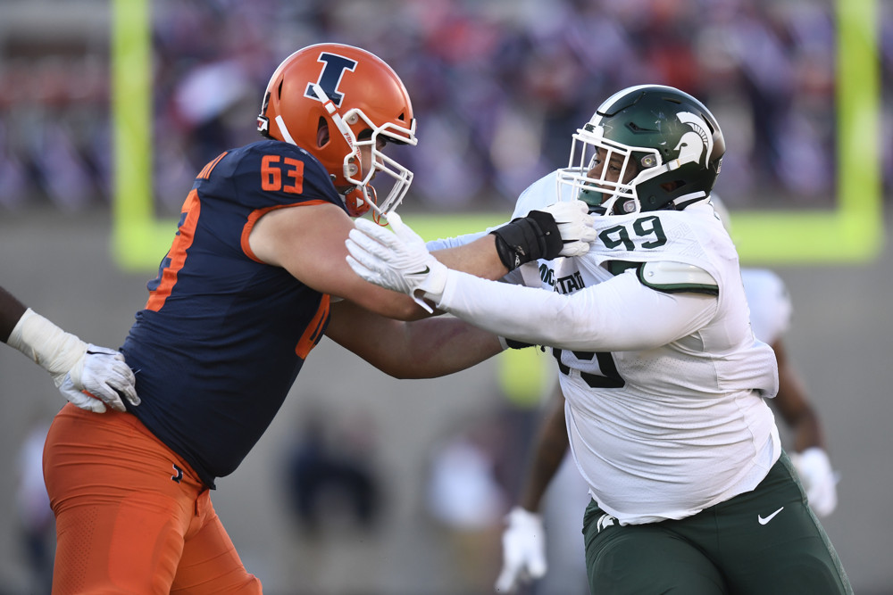 CHAMPAIGN, IL - NOVEMBER 05: Denver Broncos offensive lineman Alex Palczewski (63) blocks Michigan State Spartans defensive tackle Jalen Hunt (99) during the college football game between the Michigan State Spartans and the Illinois Fighting Illini on November 5, 2022, at Memorial Stadium in Champaign, Illinois. (Photo by Michael Allio/Icon Sportswire)