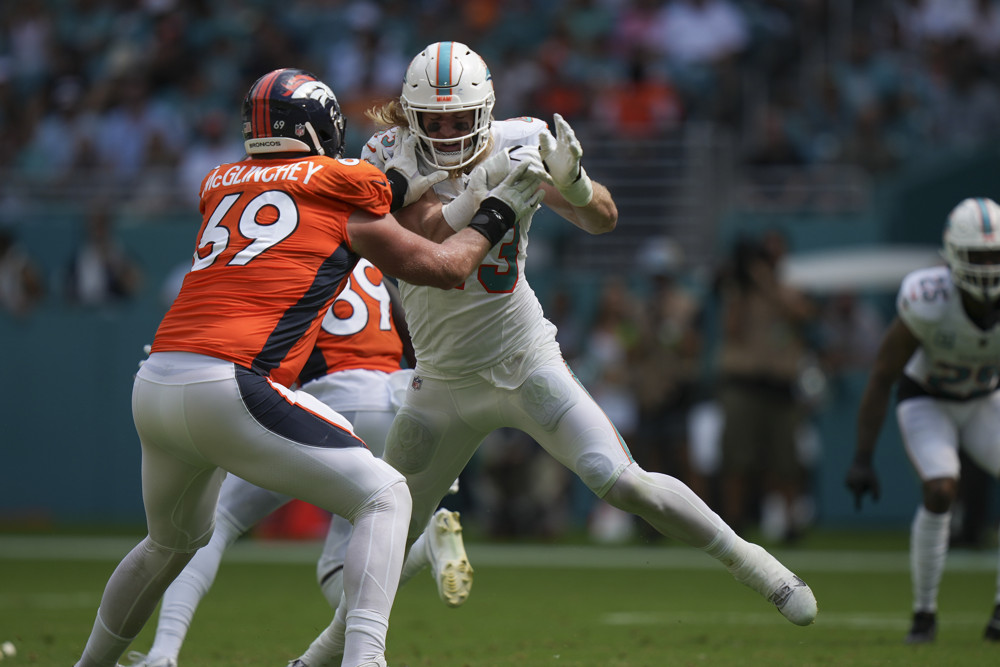 Miami Dolphins linebacker Andrew Van Ginkel (43) blitzes but is stopped by Denver Broncos offensive tackle Mike McGlinchey (69) during the game between the Denver Broncos and the Miami Dolphins on Sunday, September 24, 2023 at Hard Rock Stadium, Miami, Fla.