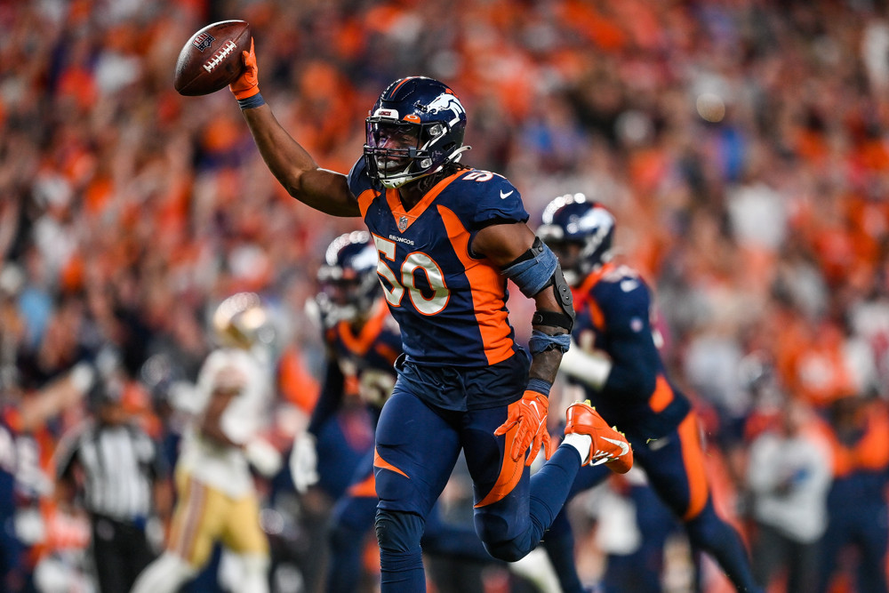 Denver Broncos linebacker Jonas Griffith (50) celebrates after interceopting a pass in the fourth quarter during a game between the San Francisco 49ers and the Denver Broncos at Empower Field at Mile High on September 25, 2022 in Denver, Colorado.