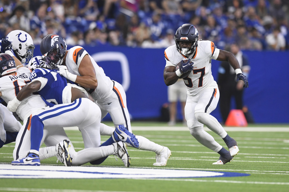 Denver Broncos Running Back Audric Estime (37) carries during the NFL Preseason game between the Denver Broncos and the Indianapolis Colts on August 11, 2024, at Lucas Oil Stadium in Indianapolis, Indiana.