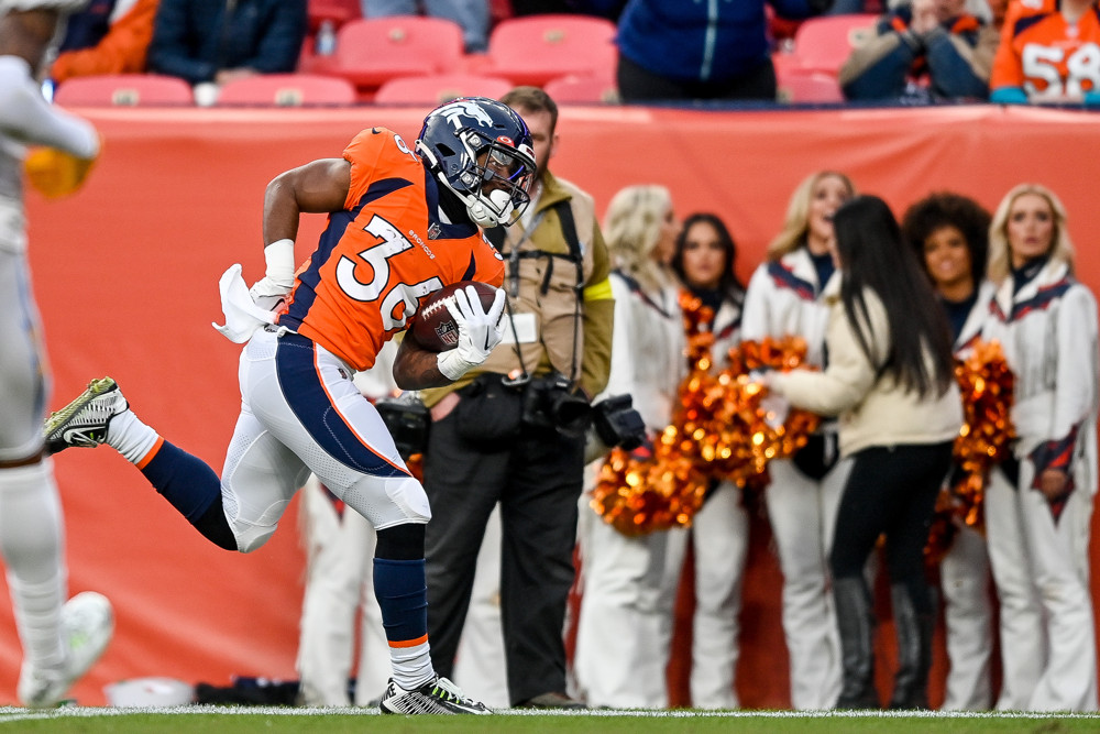 Denver Broncos running back Tyler Badie (36) runs after a catch and scores a third quarter touchdown during a game between the Los Angeles Chargers and the Denver Broncos at Empower Field at Mile High on January 8, 2023 in Denver, Colorado.