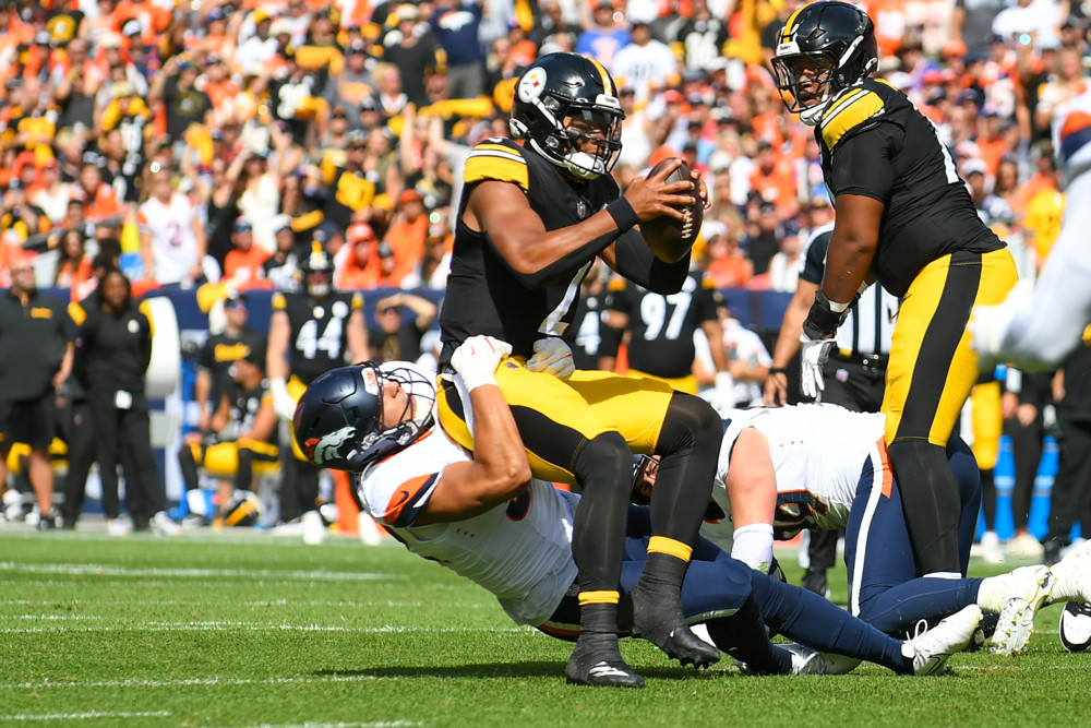 Pittsburgh quarterback Justin Fields (2) is sacked by the Denver defense during a game between the Denver Broncos and the Pittsburgh Steelers at Empower Field at Mile High in Denver, CO on September 15, 2024. 