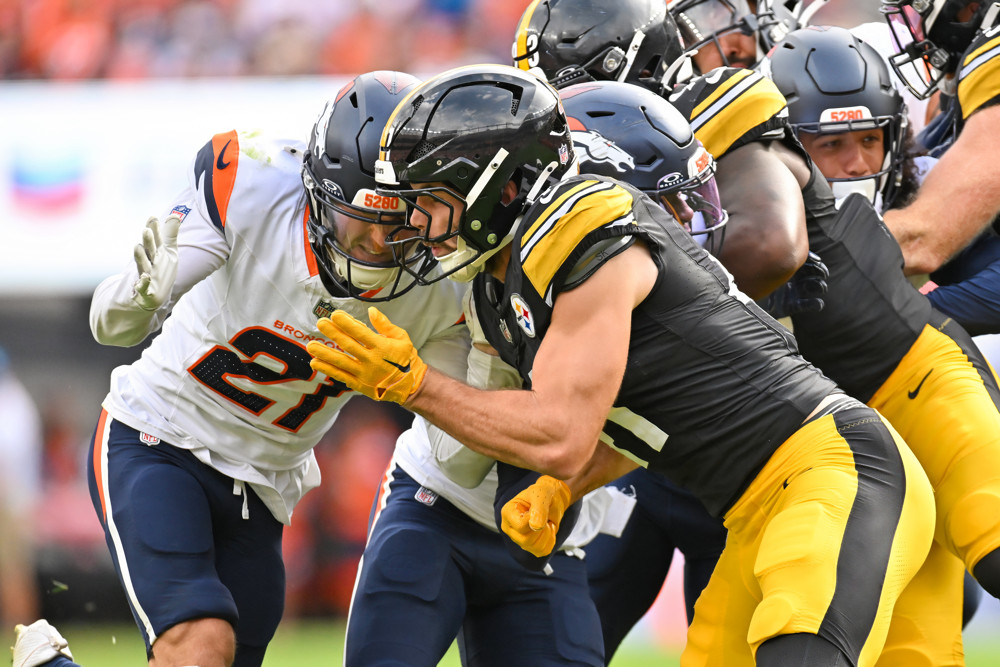 Denver cornerback Riley Moss (21) and Pittsburgh linebacker Payton Wilson (41) clash during a game between the Denver Broncos and the Pittsburgh Steelers at Empower Field at Mile High in Denver, CO on September 15, 2024. 