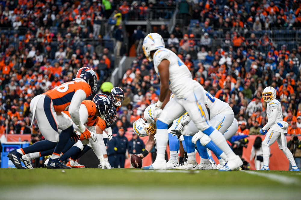 Los Angeles Chargers center Corey Linsley (63) sets to snap during a game between the Los Angeles Chargers and the Denver Broncos at Empower Field at Mile High on January 8, 2023 in Denver, Colorado. (Photo by Dustin