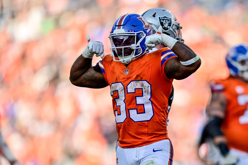 Denver Broncos running back Javonte Williams (33) celebrates after a first down run during a game between the Las Vegas Raiders and the Denver Broncos at Empower Field at Mile High on October 6, 2024 in Denver, Colorado.