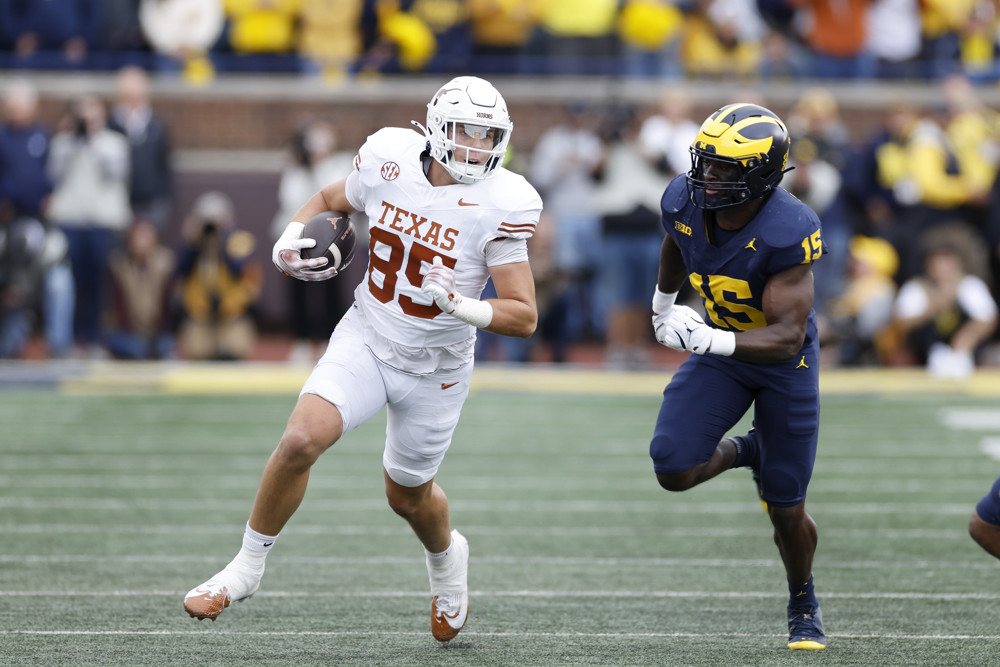 Texas Longhorns tight end Gunnar Helm (85) runs with the ball after a reception during a college football game against the Michigan Wolverines on September 07, 2024 at Michigan Stadium in Ann Arbor, Michigan.