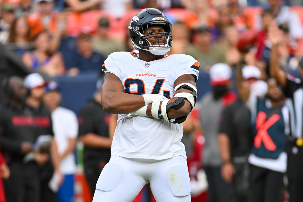 Denver Broncos defensive tackle Jordan Jackson (94) poses after sacking the Arizona Cardinals quarterback during the NFL preseason game between the Denver Broncos and the Arizona Cardinals on August 25, 2024, at Empower Field at Mile High Stadium in Denver, CO.