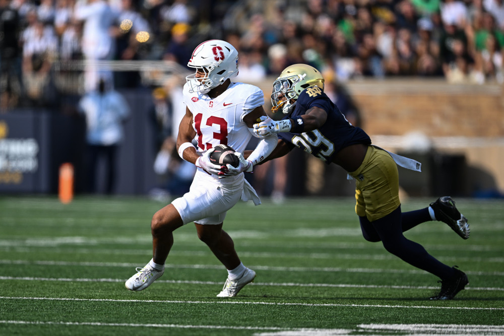 Notre Dame Fighting Irish CB Christian Gray (29) attempts to tackle Stanford Cardinal WR Elic Ayomanor (13) during a college football game between the Stanford Cardinal and Notre Dame Fighting Irish on October 12, 2024 at Notre Dame Stadium in South Bend, IN