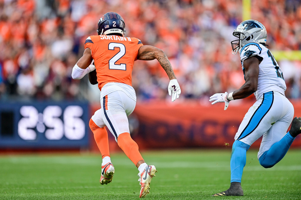 Denver Broncos cornerback Pat Surtain II (2) runs after securiung an interception in the third quarter during a game between the Carolina Panthers and the Denver Broncos at Empower Field at Mile High on October 27, 2024 in Denver, Colorado. 