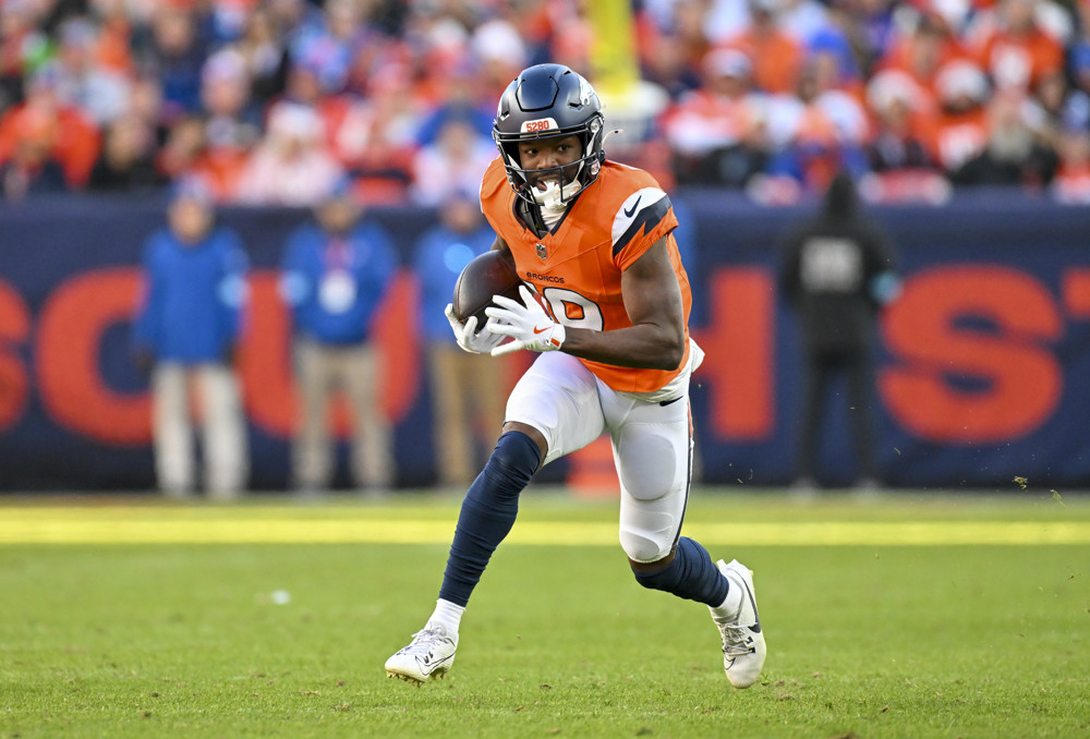 Denver wide receiver Marvin Mims Jr. (19) runs the ball during a game between the Indianapolis Colts and the Denver Broncos at Empower Field at Mile High in Denver, CO on December 15, 2024.