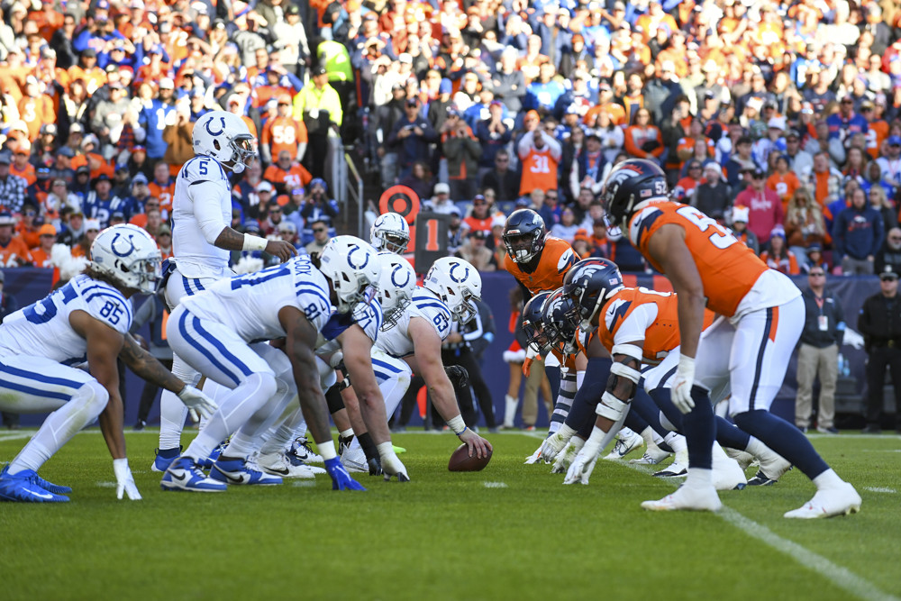 The Indianapolis offense lines up against the Denver Broncos defense, during a game between the Indianapolis Colts and the Denver Broncos at Empower Field at Mile High in Denver, CO on December 15, 2024.