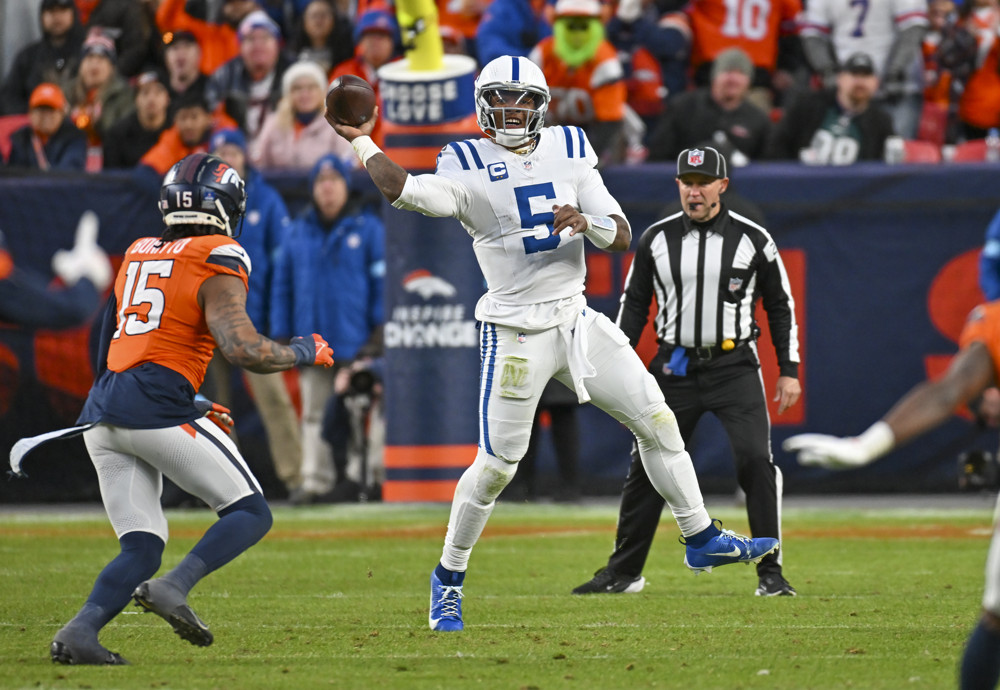 Indianapolis quarterback Anthony Richardson (5) makes an off balance throw during a game between the Indianapolis Colts and the Denver Broncos at Empower Field at Mile High in Denver, CO on December 15, 2024.