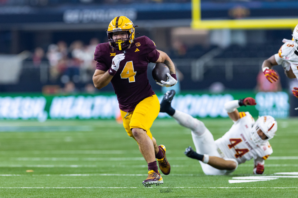 Arizona State Sun Devils and Senior Bowl running back Cam Skattebo (#4) runs up field during the Big 12 championship football game between the Arizona State Sun Devils and the Iowa State Cyclones on December 7, 2024 at AT&T Stadium in Arlington, TX.