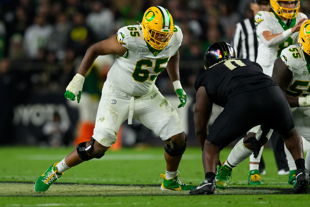 Oregon DucksÊoffensive lineman Ajani Cornelius (65) blocks Purdue Boilermakers defensive lineman Jeffrey M'Ba (0) during the college football game between the Purdue Boilermakers and Oregon Ducks on October 18, 2024, at Ross-Ade Stadium in West Lafayette, IN. 