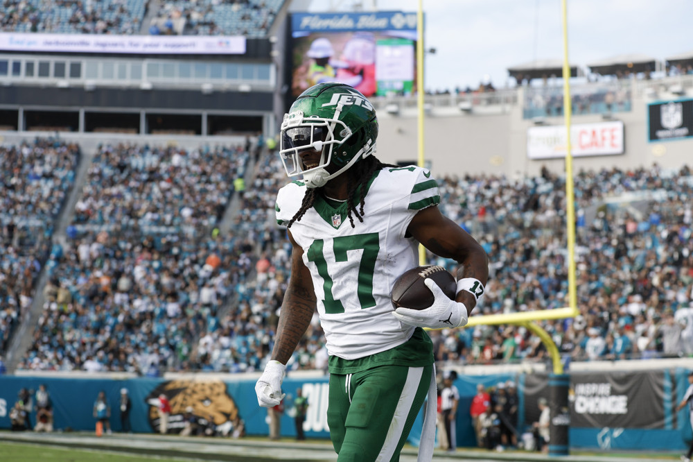 New York Jets wide receiver Davante Adams (17) celebrates his 100th career touchdown during the game between the Jacksonville Jaguars and the New York Jets on December 15, 2024 at EverBank Stadium in Jacksonville, Fl.