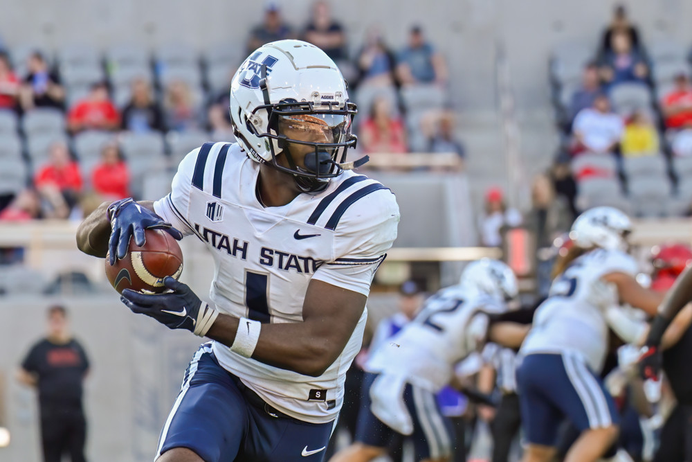 Utah State Aggies wide receiver Jalen Royals (1) runs with the ball during a game between the Utah State Aggies and the San Diego State Aztecs on November 04, 2023, at Snapdragon Stadium in San Diego, CA.