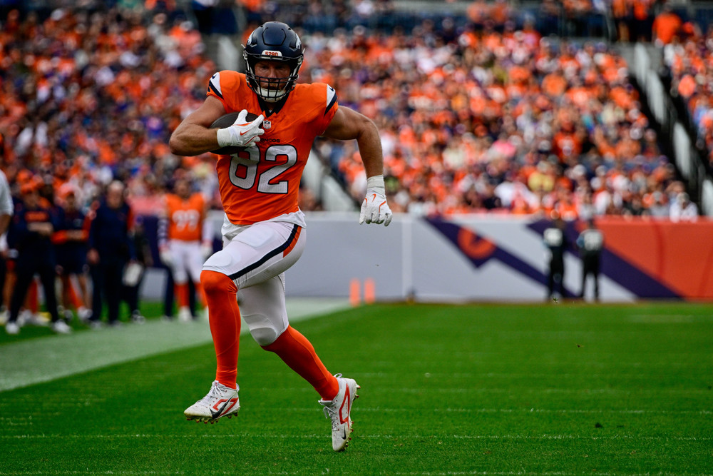 Denver Broncos tight end Adam Trautman (82) runs after a catch in the second quarter during a game between the Carolina Panthers and the Denver Broncos at Empower Field at Mile High on October 27, 2024 in Denver, Colorado.