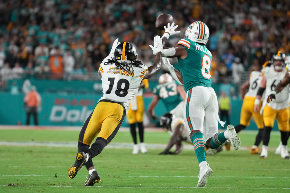 Miami Dolphins safety Jevon Holland (8) steps in front of Pittsburgh Steelers wide receiver Diontae Johnson (18) for an interception during the game between the Pittsburg Steelers and the Miami Dolphins on Sunday, October 23, 2022 at Hard Rock Stadium, Miami Gardens, FL