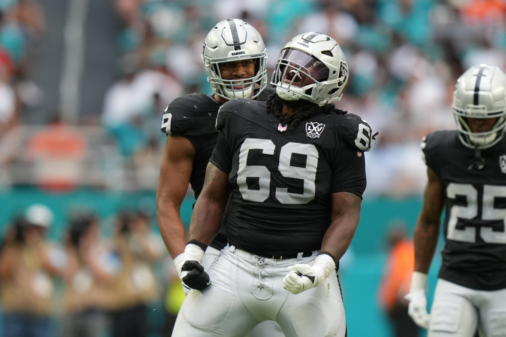 Las Vegas Raiders defensive tackle Adam Butler (69) celebrates after a stop during the game between the Las Vegas Raiders and the Miami Dolphins on Sunday, November 17, 2024 at Hard Rock Stadium in Miami Gardens, Fla.