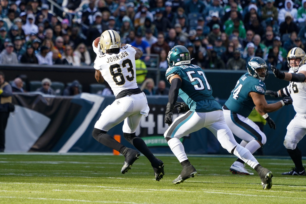 New Orleans Saints Tight End Juwan Johnson (83) makes a catch against Philadelphia Eagles Linebacker T.J. Edwards (57) during the first half of the National Football League game between the New Orleans Saints and the Philadelphia Eagles on January 1, 2023, at Lincoln Financial Field in Philadelphia, PA. 