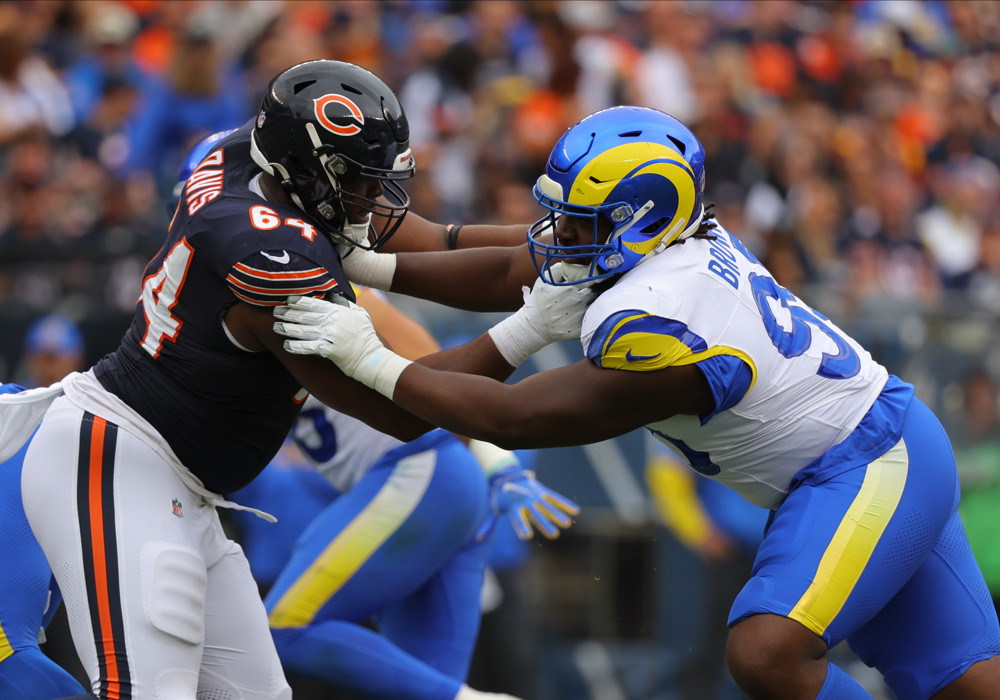 Chicago Bears guard Nate Davis (64) and Los Angeles Rams defensive tackle Bobby Brown III (95) during the second half on September 29, 2024 at Soldier Field in Chicago, Illinois. 