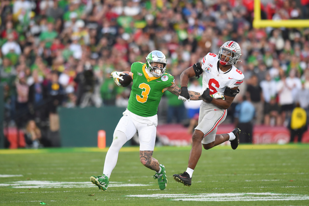 Tight End Terrance Ferguson #3 of the Oregon Ducks stiff arms Linebacker Sonny Styles #6 of the Ohio State Buckeyes during the Ohio State Buckeyes versus Oregon Ducks College Football Playoff Quarterfinal at the Rose Bowl Game on January 1, 2025, at the Rose Bowl Stadium in Pasadena, CA.