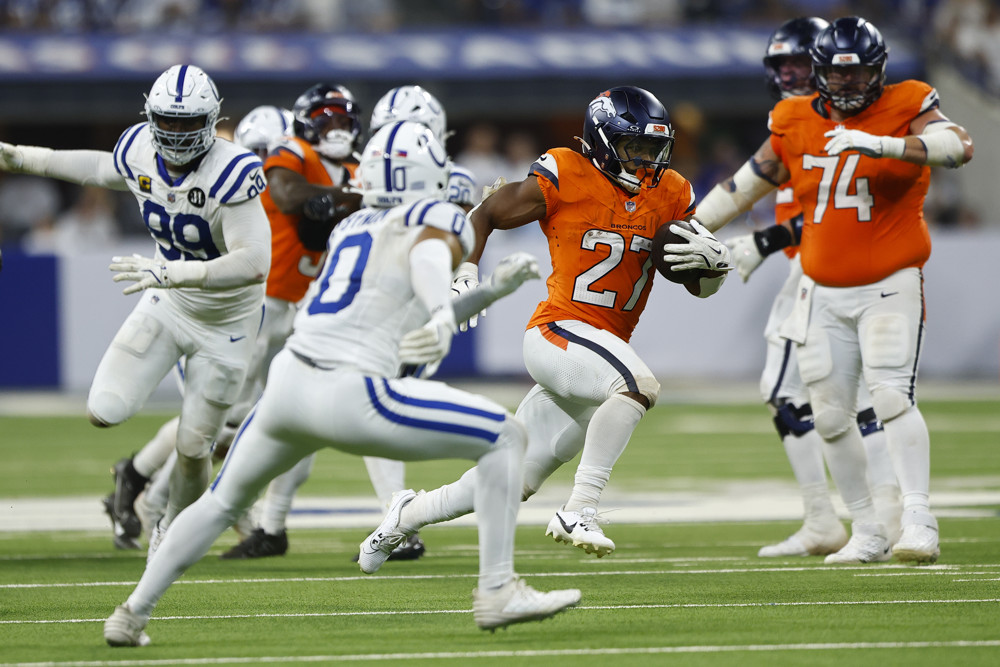 Denver Broncos running back J.K. Dobbins (27) cuts back up field during an NFL game between the Denver Broncos and the Indianapolis Colts on September 14, 2025 at Lucas Oil Stadium in Indianapolis, IN.
