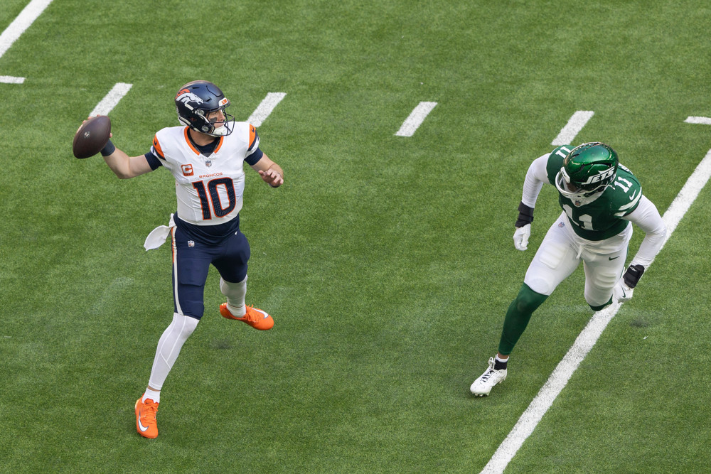 Denver Broncos Quarterback Bo Nix passes on October 12, 2025, at Tottenham Hotspur Stadium in London, England.