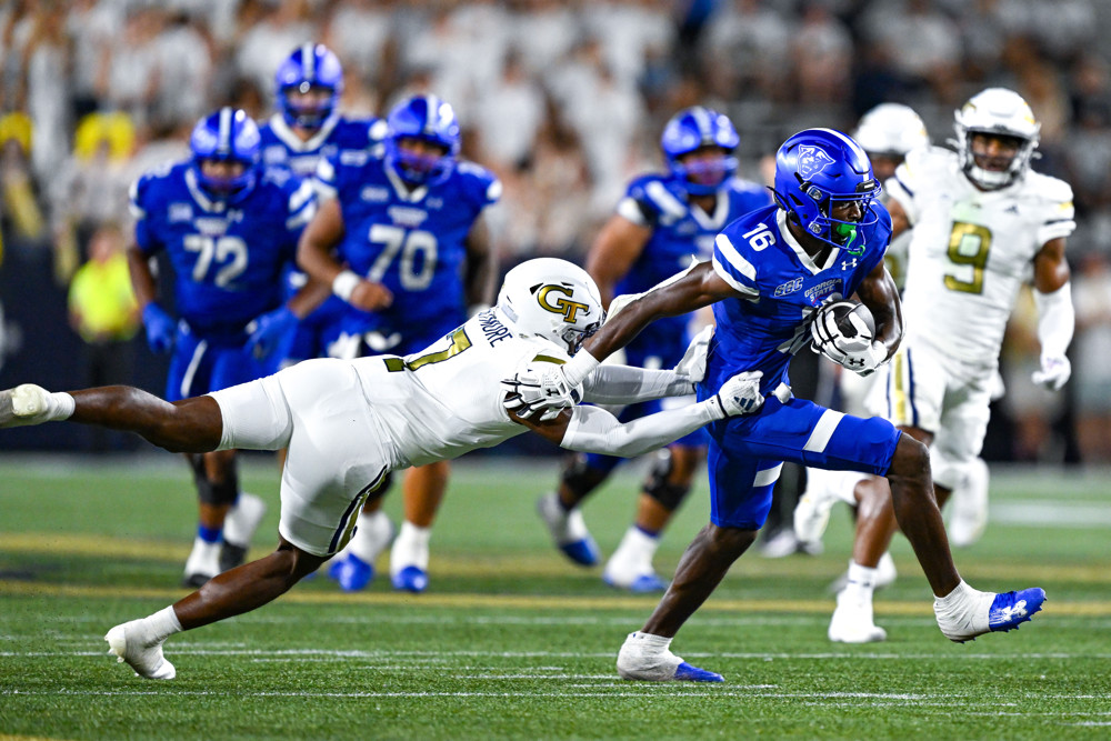 Georgia State wide receiver Ted Hurst (16) runs by Georgia Tech defensive back Taye Seymore (7) during the college football game between the Georgia State Panthers and the Georgia Tech Yellow Jackets on August 31st, 2024 at Bobby Dodd Stadium in Atlanta, GA. 