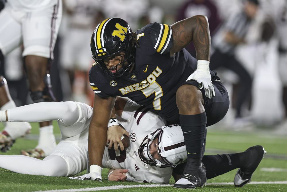 Missouri Tigers defensive lineman Chris McClellan (7) sacks Mississippi State Bulldogs quarterback Blake Shapen (2) in the first quarter of an SEC football game between the Mississippi State Bulldogs and Missouri Tigers on November 15, 2025 at Memorial Stadium in Columbia, MO.