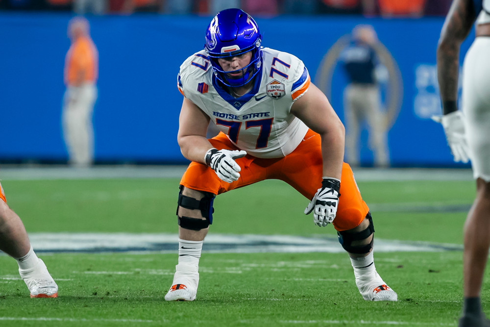 Boise State offensive tackle Kage Casey (77) gets set for a snap during the Penn State Nittany Lions versus Boise State Broncos College Football Playoff Quarterfinal at the Vrbo Fiesta Bowl on December 31, 2024, at State Farm Stadium in Glendale, AZ.